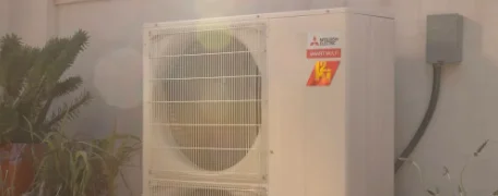 Technicians servicing a mini-split system